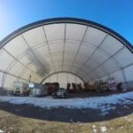 Image of a durable fabric hoop building with snow